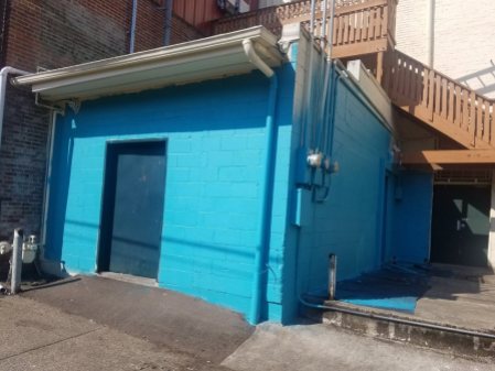 The mural location with a fresh coat of blue paint.